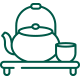 Icon of a teapot and cup sitting on a low table